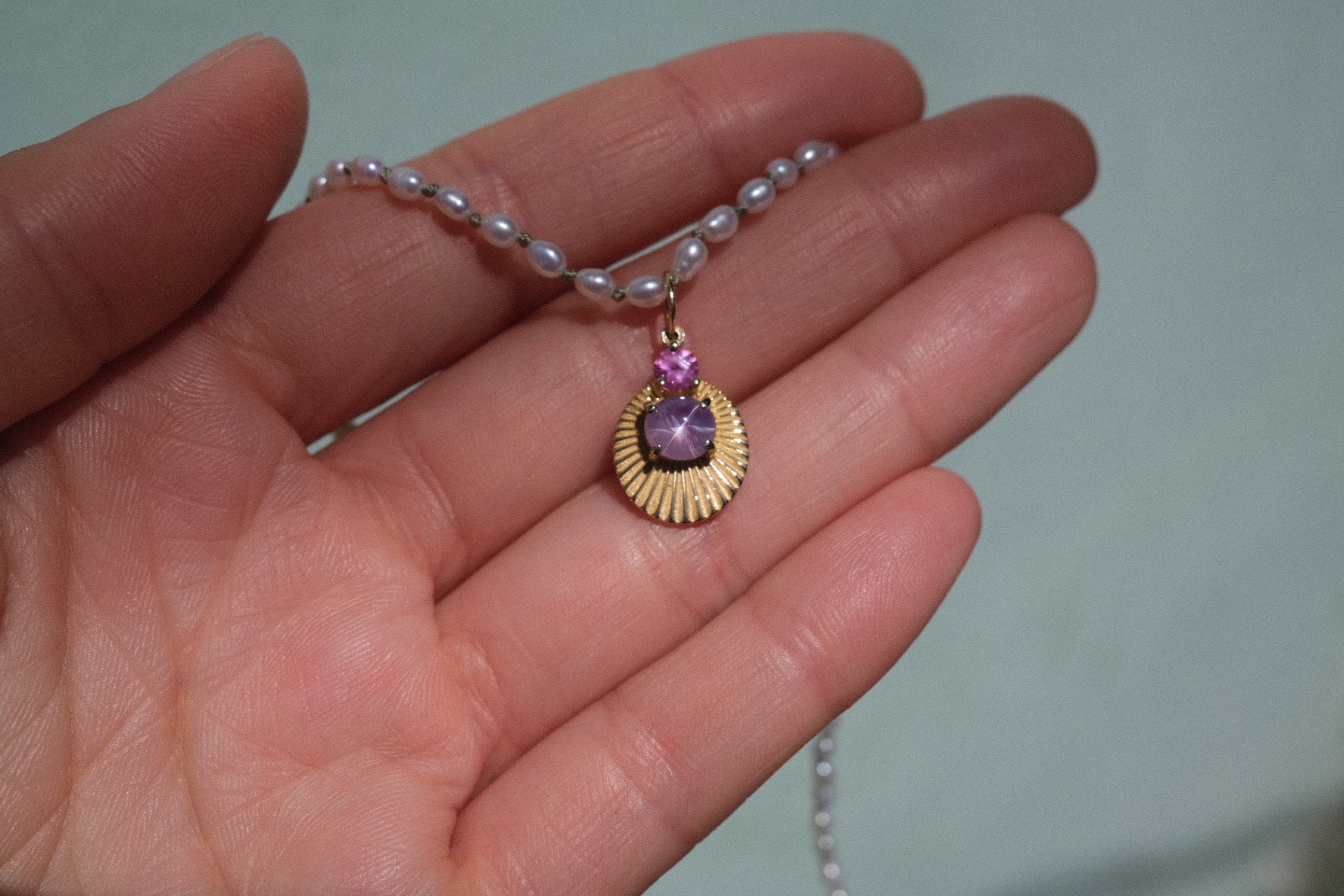 JoyLight charm with lilac star sapphire and pink sapphire accent