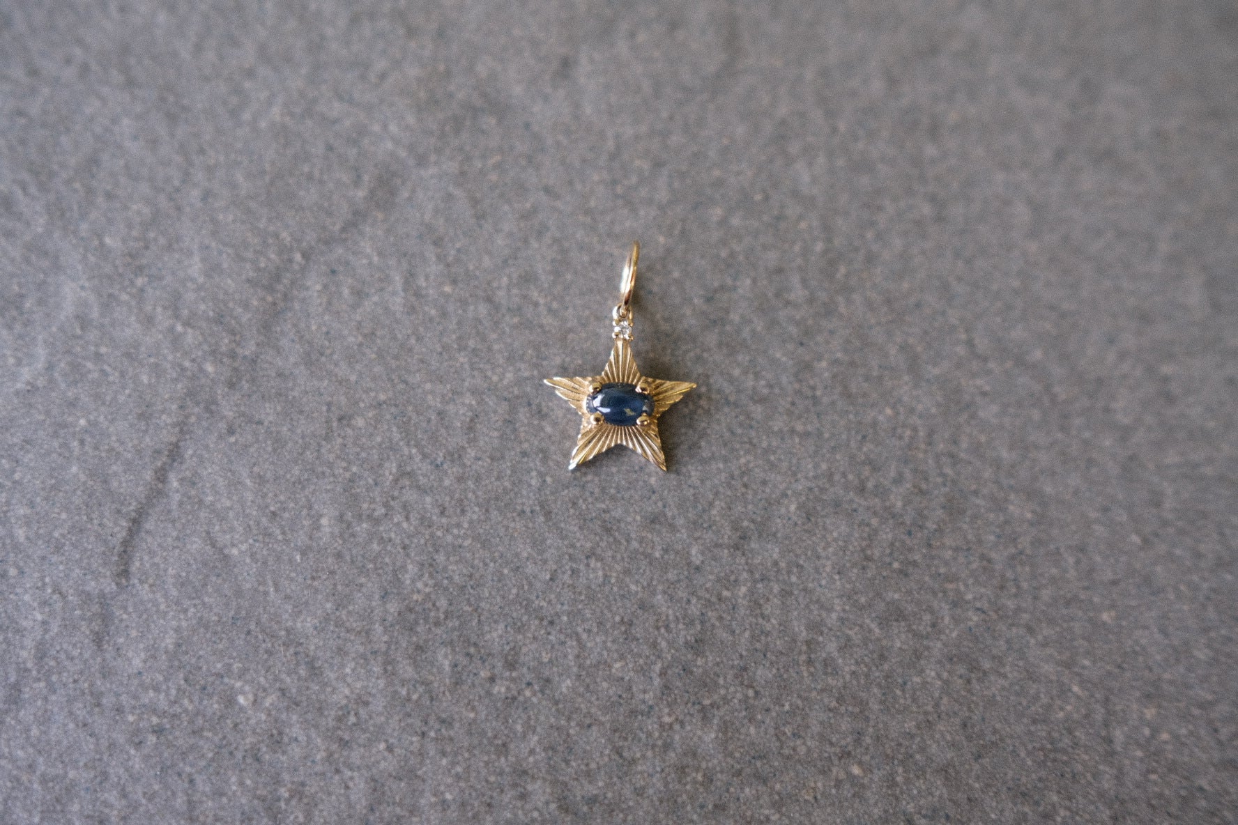 StarLight charm with dark blue star sapphire and diamond